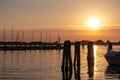 Chioggia - Beautiful sailing boats gracefully adorn the picturesque port of the charming town of Chioggia at sunrise Royalty Free Stock Photo