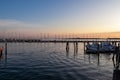 Chioggia - Beautiful sailing boats gracefully adorn the picturesque port of the charming town of Chioggia at sunrise Royalty Free Stock Photo