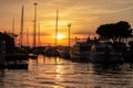 Chioggia - Beautiful sailing boats gracefully adorn the picturesque port of the charming town of Chioggia at sunrise Royalty Free Stock Photo