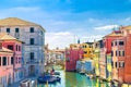 Chioggia cityscape with narrow water canal Vena with moored multicolored boats