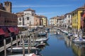 Chioggia, ITALY - June 8, 2022: Pictoresque streets of Chioggia town with water canal, boats and old buldings Royalty Free Stock Photo