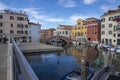 Chioggia, ITALY - June 8, 2022: Pictoresque streets of Chioggia town with water canal, boats and old buldings Royalty Free Stock Photo