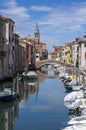 Chioggia, ITALY - June 10, 2022: Pictoresque streets of Chioggia town with water canal, boats and old buldings Royalty Free Stock Photo