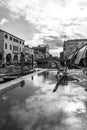 Chioggia, Venice, Italy: landscape of the old town and the canal with fishing boats and ancient buildings. Black And White Photogr