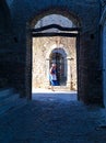 Old senior tourist woman in the medieval village of Mesta