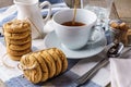 Chip cookies, a cup of tea, sugar, milk, glass of ice water. Royalty Free Stock Photo