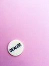 Chip dealer lies on a pink background. The game of poker. Place for text. Gambling Royalty Free Stock Photo