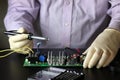 Chip soldering man hands Royalty Free Stock Photo