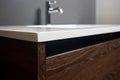 Chipboard CPD particle board particleboard LDSP under basin cabinet corner and table top closeup. Bathroom interior Royalty Free Stock Photo