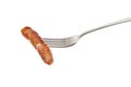 Chipolata sausage on a fork