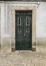 Chipped facade with old green wooden door Royalty Free Stock Photo