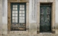 Chipped facade with old green wooden door and window Royalty Free Stock Photo