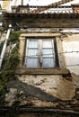 Chipped facade with old green wooden window Royalty Free Stock Photo