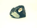 Chipped obsidian stone with cavity inside, sharp cracks flint