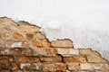Chipped plaster from the wall and visible brickwork Royalty Free Stock Photo