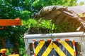 Chipper wood machine releasing the shredded woods into a truck Royalty Free Stock Photo