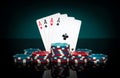 Chips and aces cards. Playing cards in poker with with four of a kind or quads combination. Succeed and win in casino Royalty Free Stock Photo