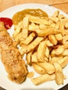 Chips and battered sausage Royalty Free Stock Photo