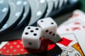 Chips with cards and dices for poker game, closeup Royalty Free Stock Photo