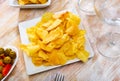 Chips and olives served in bowl for snack