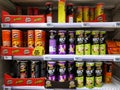 Chips Pringles on store shelves in a supermarket