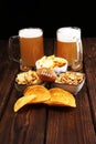 Chips, salty snacks, football and Beer on a table. Great for Bowl Game projects