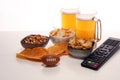 Chips, salty snacks, football and Beer on a table. Great for Bowl Game projects