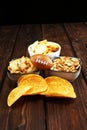 Chips, salty snacks, football on a table. Great for Bowl Game