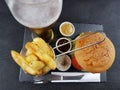 Chips sauces burger beer blackplate blackbackground