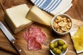 Chips, sausage, cheese, olives on a wooden table Royalty Free Stock Photo