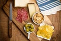 Chips, sausage, cheese, olives on a wooden table Royalty Free Stock Photo