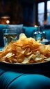 Chips snack, prominently placed on a coffee table in a chic blue decorated lounge