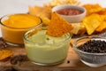 Chips and snacks with avocado and dip sauce, close-up top view Royalty Free Stock Photo