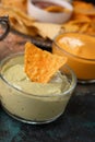 Chips and snacks with avocado and dip sauce, close-up top view Royalty Free Stock Photo