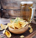 Chips in a wooden bowl and beer Royalty Free Stock Photo