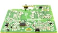 chipset and electronic component installed on green circuit board with white background