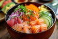 Chirashi Bowl: A colorful bowl of vinegared rice topped with a variety of sashimi, vegetables, and garnishes. Royalty Free Stock Photo