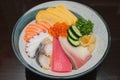 Chirashi donburi on wooden table.