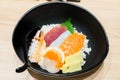 Chirashi Sushi bowl with salmon tuna shrimp served with Wasabi