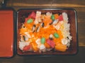 Chirashi sushi with mixed raw fish and salmon roe over rice in box Royalty Free Stock Photo