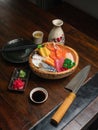 Chirashi Sushi on the wooden table with a Japannese sushi knife Royalty Free Stock Photo