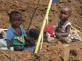 Two toddlers playing outdoors