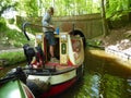 Canal narrowboat entering tunnel