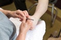 Chiropodist at home makes a treatment of the feet Royalty Free Stock Photo