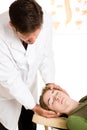 Chiropracter Treats Headache Royalty Free Stock Photo