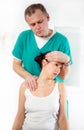 Chiropractor adjusting neck muscles Royalty Free Stock Photo