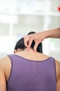 Chiropractor adjusting neck muscles to female Royalty Free Stock Photo