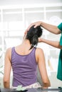 Chiropractor adjusting neck muscles to female Royalty Free Stock Photo