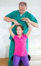 Chiropractor doing adjustment on female patient Royalty Free Stock Photo