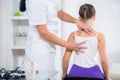 Chiropractor doing adjustment on female patient Royalty Free Stock Photo